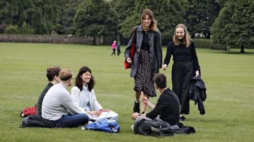 smiling engineering masters students enjoying a park in edinburgh