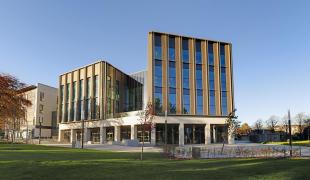 A wide angle photograph of the Nucleus Building within King's Building campus at the University of Edinburgh
