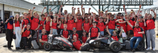 The Edinburgh University Formula Student team with their competition car at Silverstone racetrack