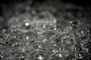 Boiling water, close up view of bubbles