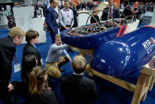 HYPED Hyperloop pod on show with crowd asking questions of Engineering students