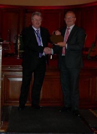 Professor Mike Forde presented with award