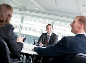 Business leaders discussing major projects in an office environment