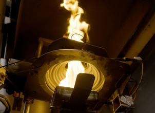 photo of fire taken from beneath an experiment in a scientific laboratory